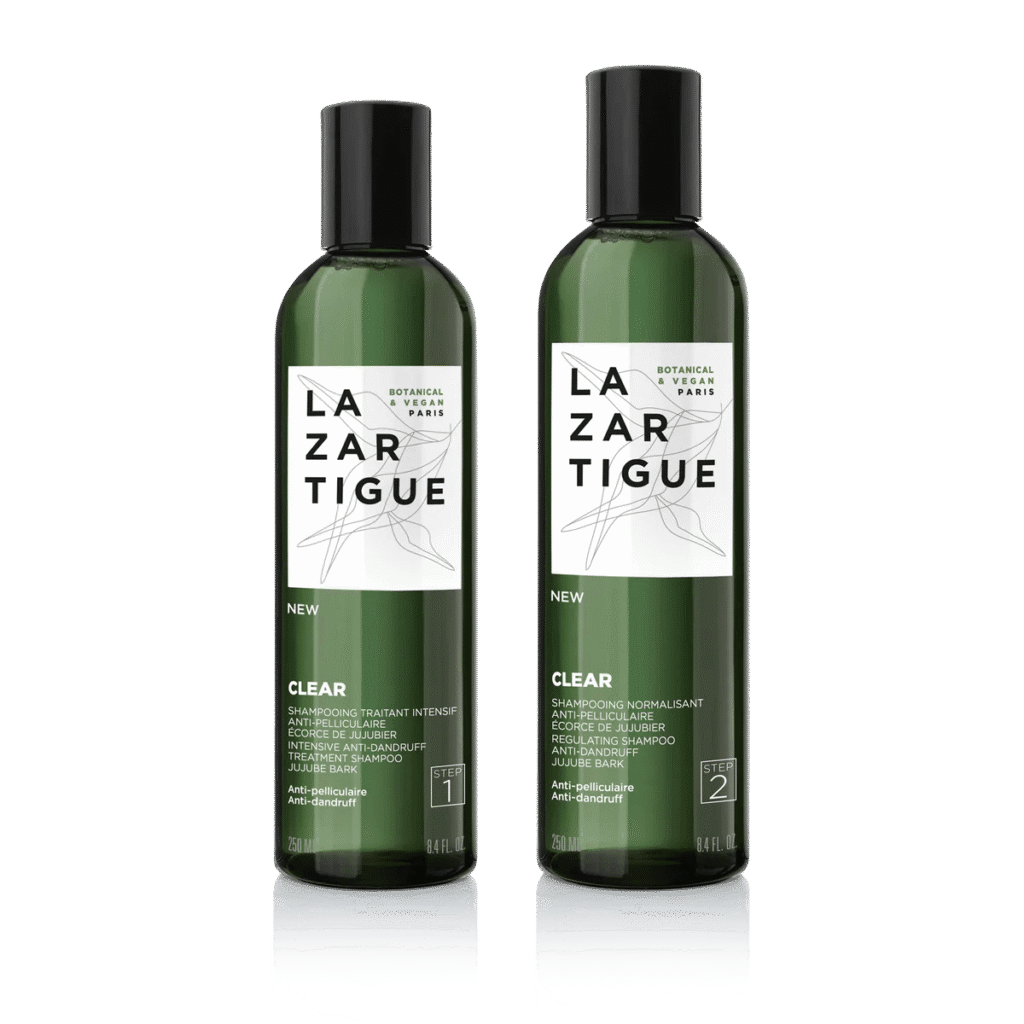 Deux bouteilles de shampoing Lazartigue anti-pelliculaire.
